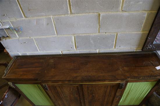 A Regency brass inset rosewood breakfront dwarf bookcase, with pierced brass three quarter gallery, two panelled and two pleated doors,